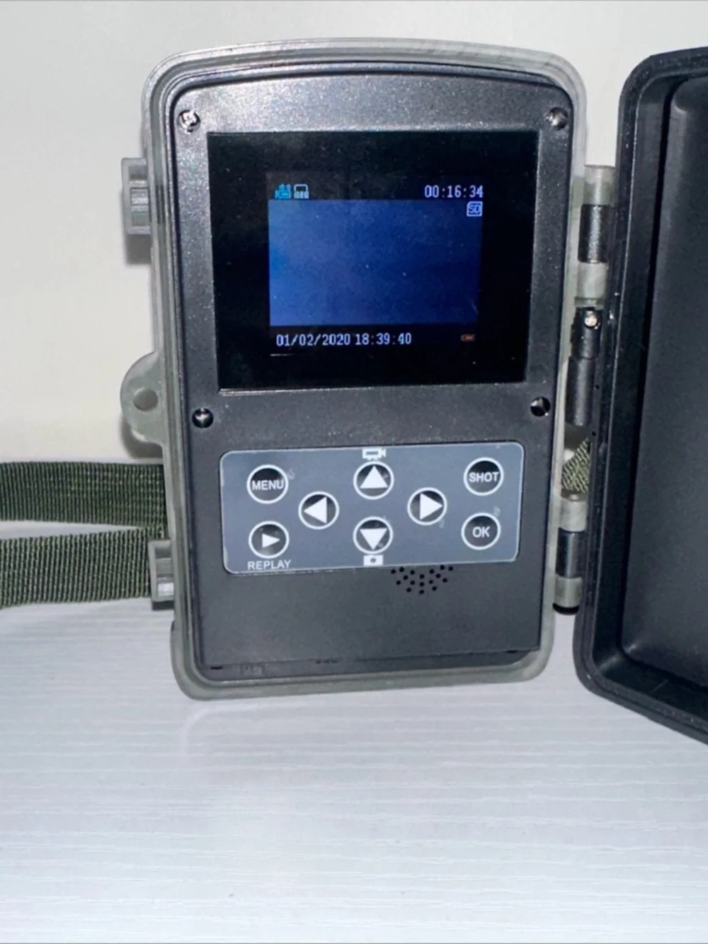 Source Unknown Camouflage Trail Camera with Dark Green Strap
